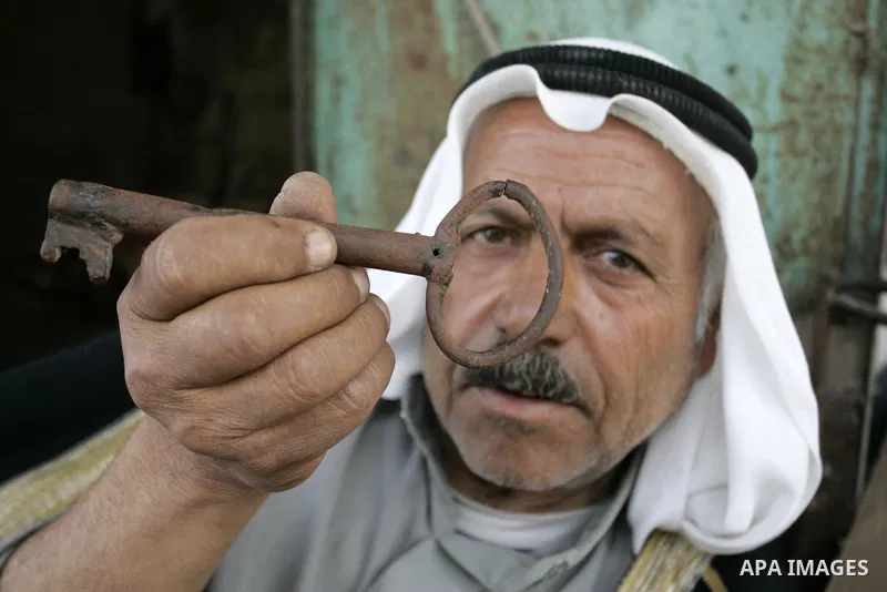 A Palestinian refugee, Ahmad Abd al-Ghani al-Akhras, 70 years old, from the Rafah refugee camp, holds up a key allegedly from his house in Wadi Hanin, now located in Israel on May 10, 2011. Palestinians commemorate the 6...