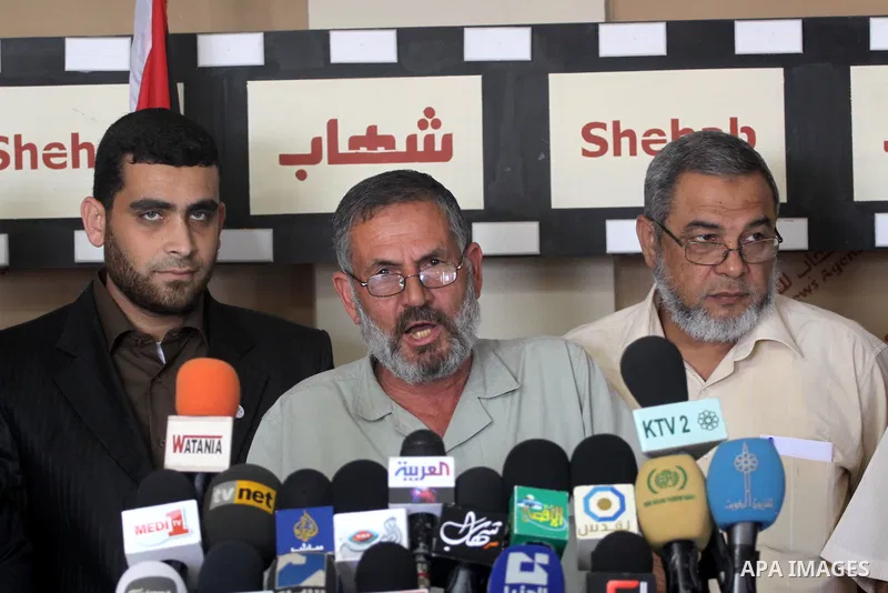 Members of Palestinian opposition factions participate in a press conference about the Palestinian reconciliation between Fatah and Hamas in Gaza City on May 10,2011. Photo by Mohammed Asad