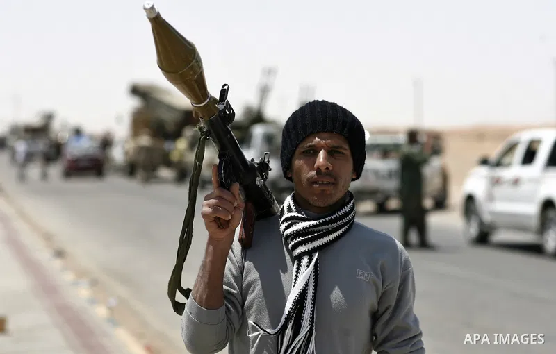 Libyan rebel fighters head towards the front line outside the Libyan eastern city Ajdabiya on May 10, 2011, where fighting between rebels and forces loyal to leader Moamer Kadhafi is ongoing. Photo by Wissam Nassar