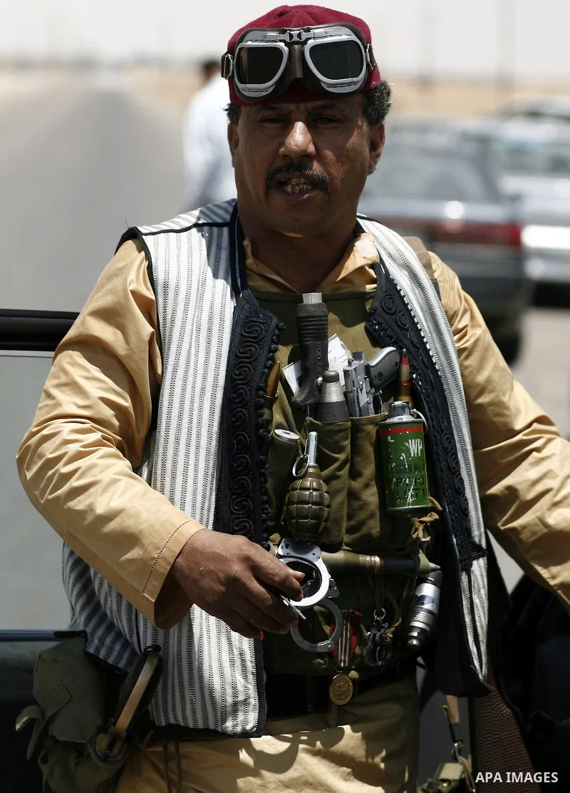 Libyan rebel fighters head towards the front line outside the Libyan eastern city Ajdabiya on May 10, 2011, where fighting between rebels and forces loyal to leader Moamer Kadhafi is ongoing. Photo by Wissam Nassar