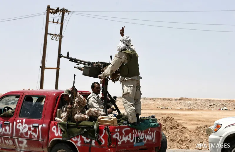 Libyan rebel fighters head towards the front line outside the Libyan eastern city Ajdabiya on May 10, 2011, where fighting between rebels and forces loyal to leader Moamer Kadhafi is ongoing. Photo by Wissam Nassar