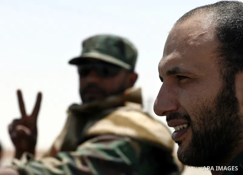 Libyan rebel fighters head towards the front line outside the Libyan eastern city Ajdabiya on May 10, 2011, where fighting between rebels and forces loyal to leader Moamer Kadhafi is ongoing. Photo by Wissam Nassar