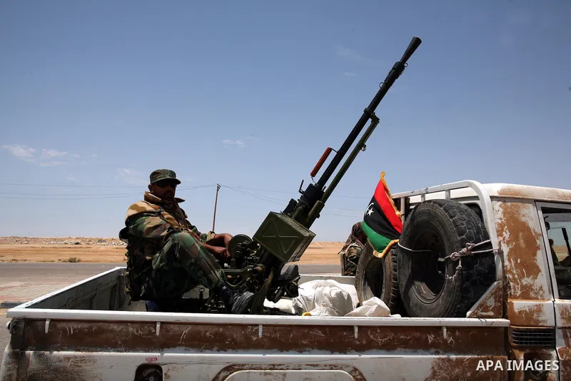 Libyan rebel fighters head towards the front line outside the Libyan eastern city Ajdabiya on May 10, 2011, where fighting between rebels and forces loyal to leader Moamer Kadhafi is ongoing. Photo by Wissam Nassar