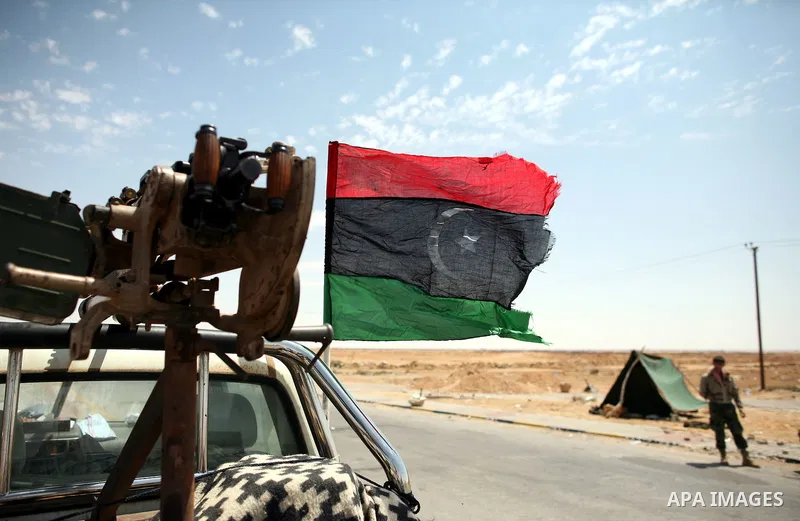 Libyan rebel fighters head towards the front line outside the Libyan eastern city Ajdabiya on May 10, 2011, where fighting between rebels and forces loyal to leader Moamer Kadhafi is ongoing. Photo by Wissam Nassar