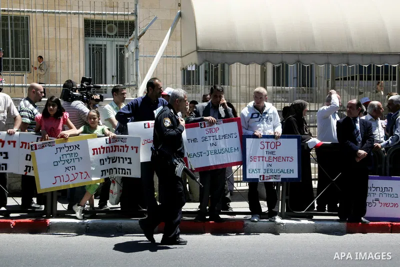 Palestinians participate in a demonstration supporting Palestinians evicted from their homes in the east Jerusalem on May 11, 2011, outside Jerusalem District Court against the city's plan to destroy homes in Silwan neig...