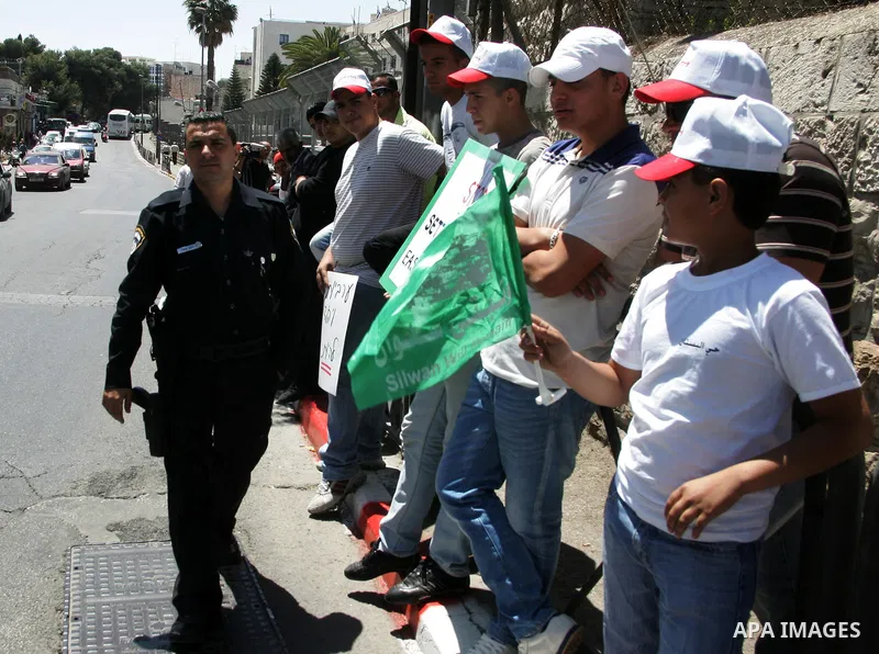 Palestinians participate in a demonstration supporting Palestinians evicted from their homes in the east Jerusalem on May 11, 2011, outside Jerusalem District Court against the city's plan to destroy homes in Silwan neig...