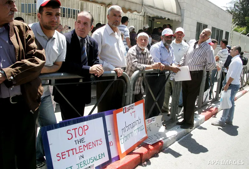 Palestinians participate in a demonstration supporting Palestinians evicted from their homes in the east Jerusalem on May 11, 2011, outside Jerusalem District Court against the city's plan to destroy homes in Silwan neig...
