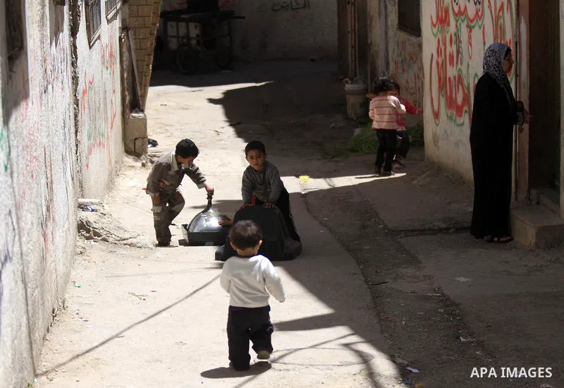 Palestinians children walk in a street in the West Bank Balata refugee camp, near Nablus on May 11, 2011, as Palestinians mark the 63rd anniversary of the "Nakba" (catastrophe). Nakba means "catastrophe" in reference to...