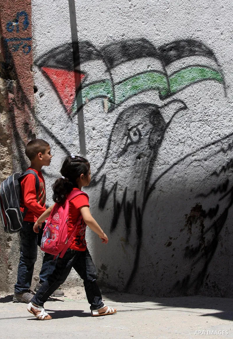 Palestinians children walk in a street in the West Bank Balata refugee camp, near Nablus on May 11, 2011, as Palestinians mark the 63rd anniversary of the "Nakba" (catastrophe). Nakba means "catastrophe" in reference to...