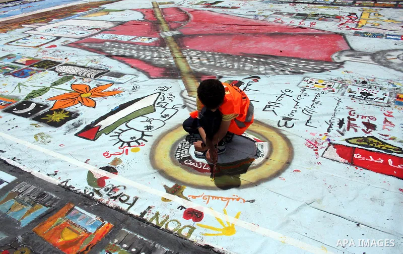 Palestinian students prepare a big mural to mark the 63th anniversary of "Nakba" (catastrophe), in the West Bank city of Ramallah, on May 12, 2011. Nakba means "catastrophe" in reference to the birth of the state of Isra...