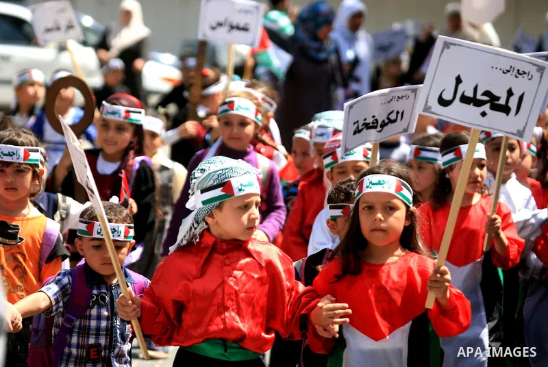 Palestinian children take part in a rally marking the 63rd anniversary of the 'Nakba', or 'Catastrophe', in Gaza City, Thursday, May 12, 2011. Hundreds of thousands of Palestinians were uprooted in the 1948 war that led...