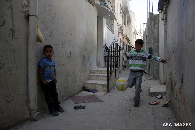 Palestinian children playing football in the Amari refugee camp, near Ramallah in the West Bank 12 May 2011. Nakba means "catastrophe" in reference to the birth of the state of Israel 63 years ago in British-mandate Pale...
