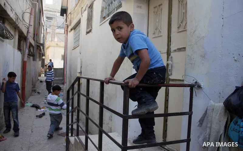 Palestinian children playing football in the Amari refugee camp, near Ramallah in the West Bank 12 May 2011. Nakba means "catastrophe" in reference to the birth of the state of Israel 63 years ago in British-mandate Pale...