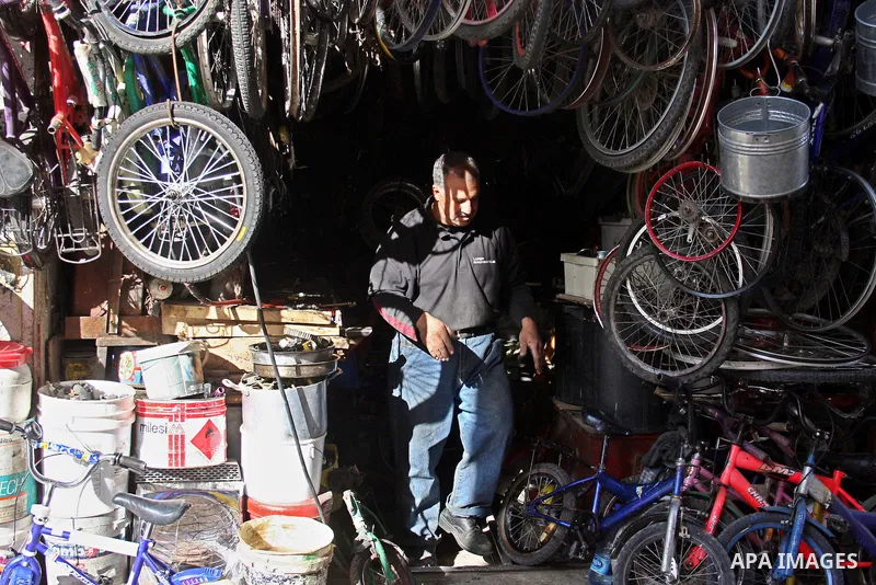 A Palestinian man Displays old equipment in his shop in the Amari refugee camp, near Ramallah in the West Bank 12 May 2011. Nakba means "catastrophe" in reference to the birth of the state of Israel 63 years ago in Briti...