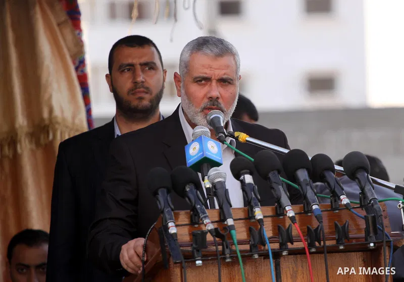 Palestinians prime minister in Gaza Strip, Ismail Haniyah watch Hamas security forces march during a graduation ceremony at the Ansar police compound in Gaza City on May 12, 2011. Photo by Mohammed Asad