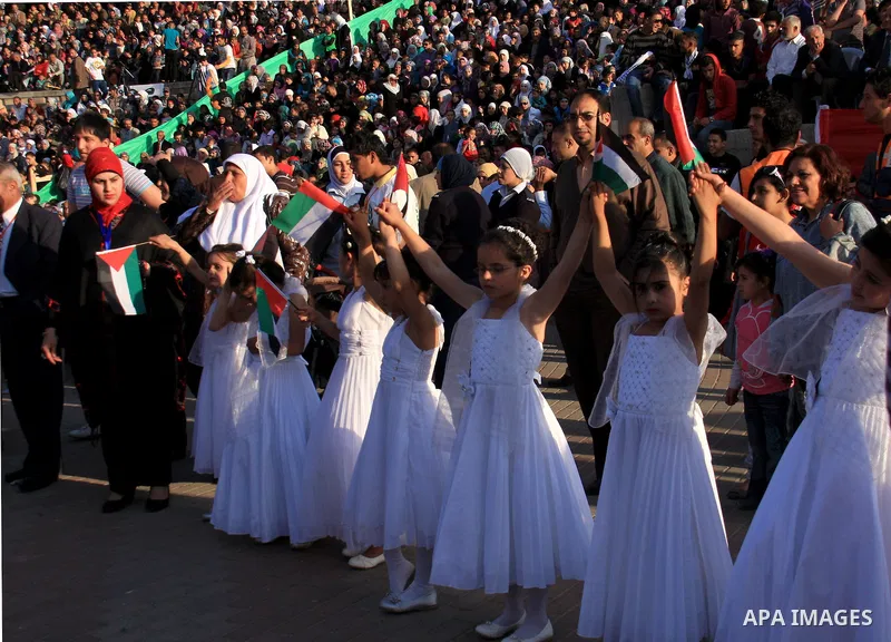 Palestinian brides and grooms take part in a mass wedding ceremony for disabled couples in the West Bank city of Nablus, Thursday, May 12, 2011. The wedding was sponsored by the United Arab Emirates and the Fatah movemen...