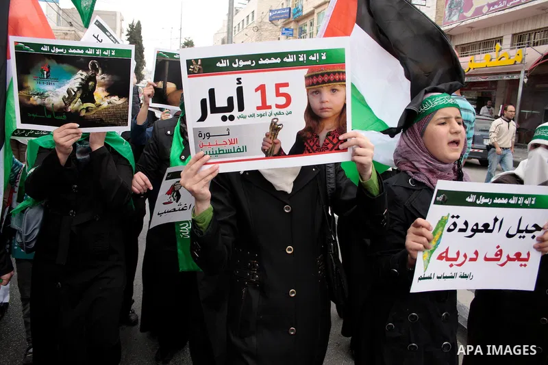 Palestinian supporters of Hamas Islamist movement attend a rally to mark the 63th anniversary of "Nakba" (catastrophe) on May 13, 2011 in the West Bank city of Hebron. Nakba means "catastrophe" in reference to the birth...