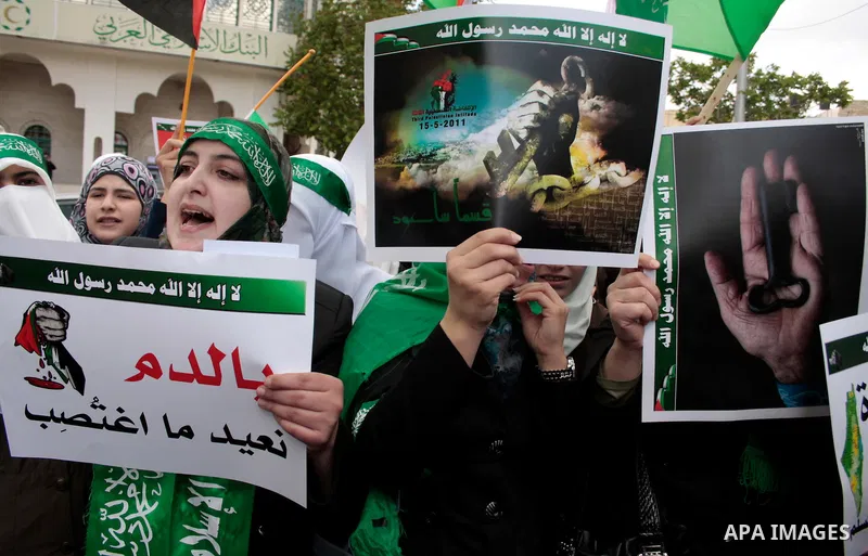 Palestinian supporters of Hamas Islamist movement attend a rally to mark the 63th anniversary of "Nakba" (catastrophe) on May 13, 2011 in the West Bank city of Hebron. Nakba means "catastrophe" in reference to the birth...