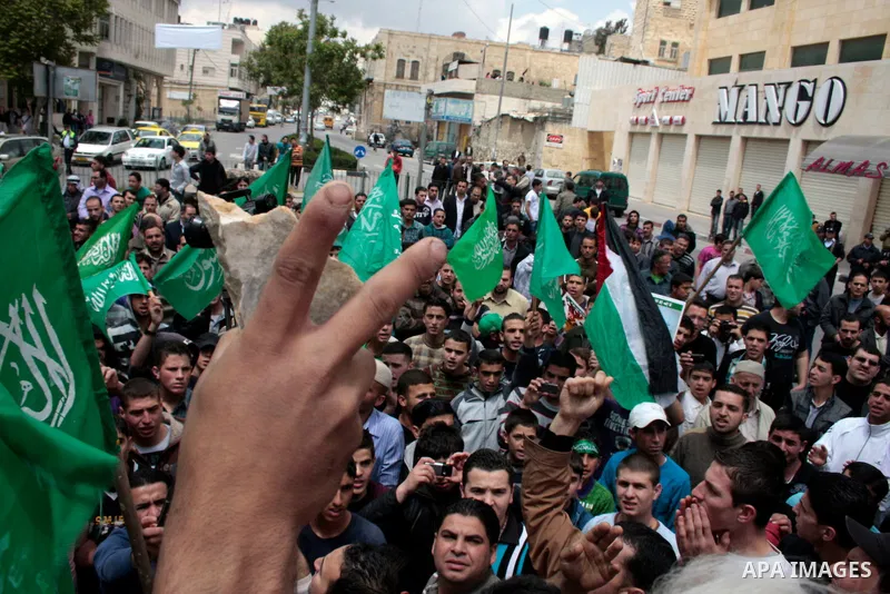 Palestinian parliament speaker, Aziz Dweik and Hamas members of the Palestinian Legislative Council (PLC) take part in a rally to mark the 63th anniversary of "Nakba" (catastrophe) on May 13, 2011 in the West Bank city o...