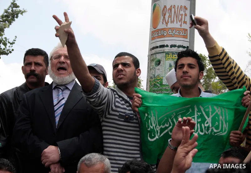 Palestinian parliament speaker, Aziz Dweik and Hamas members of the Palestinian Legislative Council (PLC) take part in a rally to mark the 63th anniversary of "Nakba" (catastrophe) on May 13, 2011 in the West Bank city o...