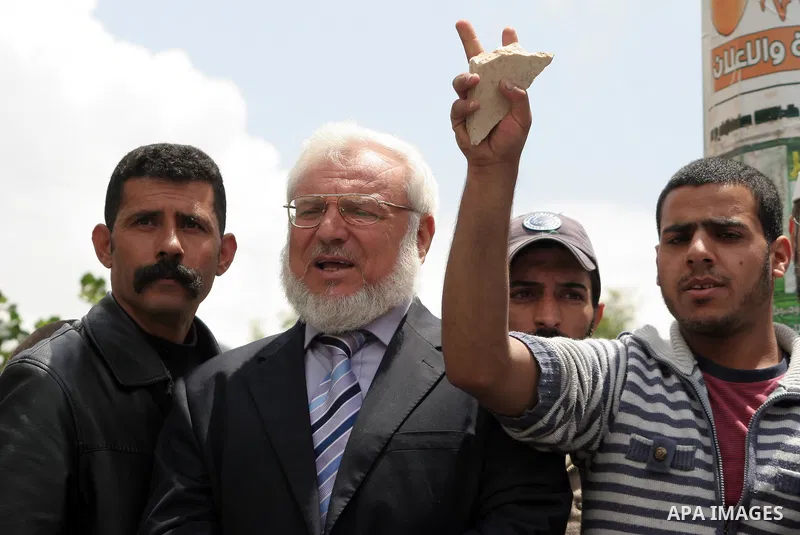 Palestinian parliament speaker, Aziz Dweik and Hamas members of the Palestinian Legislative Council (PLC) take part in a rally to mark the 63th anniversary of "Nakba" (catastrophe) on May 13, 2011 in the West Bank city o...