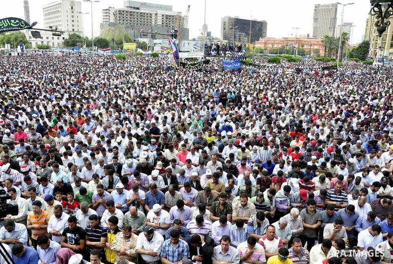 Egyptians attend Friday prayers at a rally at Cairo's Tahrir Square on May 13, 2011 during a protest calling for national unity after attacks on Egyptian churches, and solidarity with the Palestinians as they mark the "N...