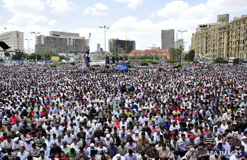 Egyptians attend Friday prayers at a rally at Cairo's Tahrir Square on May 13, 2011 during a protest calling for national unity after attacks on Egyptian churches, and solidarity with the Palestinians as they mark the "N...