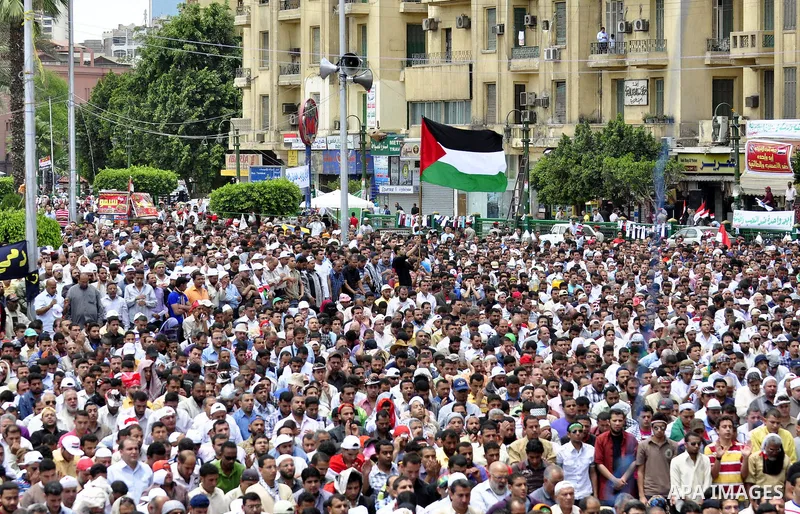 Egyptians attend Friday prayers at a rally at Cairo's Tahrir Square on May 13, 2011 during a protest calling for national unity after attacks on Egyptian churches, and solidarity with the Palestinians as they mark the "N...