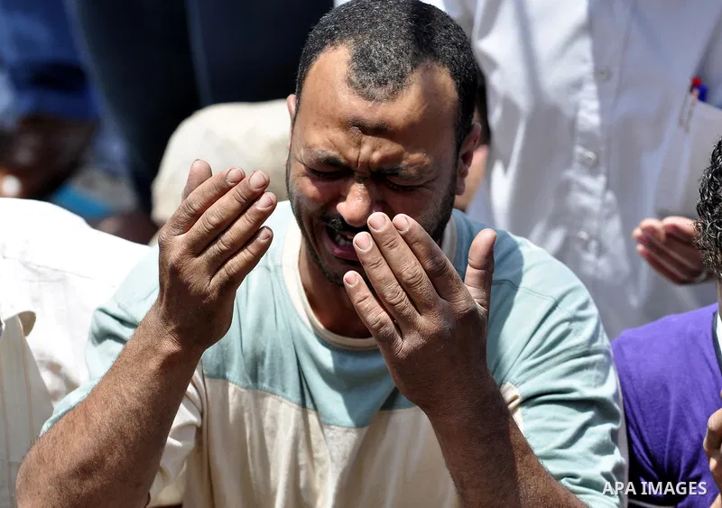Egyptians attend Friday prayers at a rally at Cairo's Tahrir Square on May 13, 2011 during a protest calling for national unity after attacks on Egyptian churches, and solidarity with the Palestinians as they mark the "N...