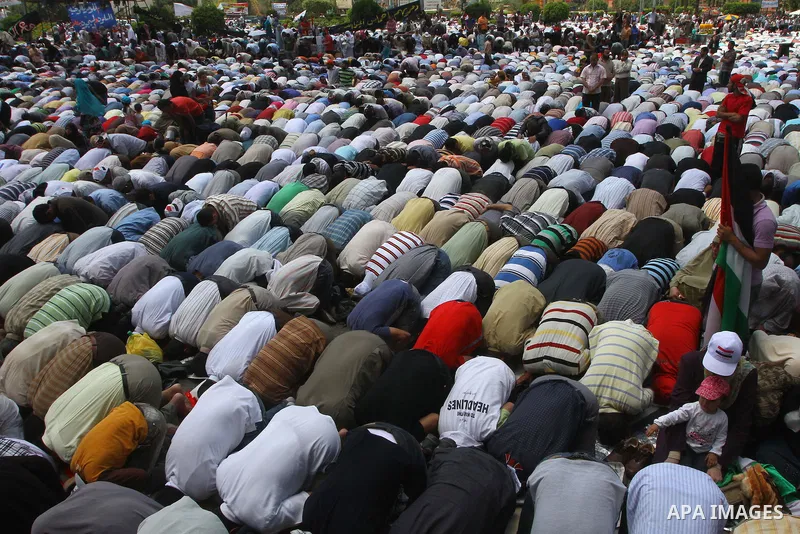 Egyptians attend Friday prayers at a rally at Cairo's Tahrir Square on May 13, 2011 during a protest calling for national unity after attacks on Egyptian churches, and solidarity with the Palestinians as they mark the "N...