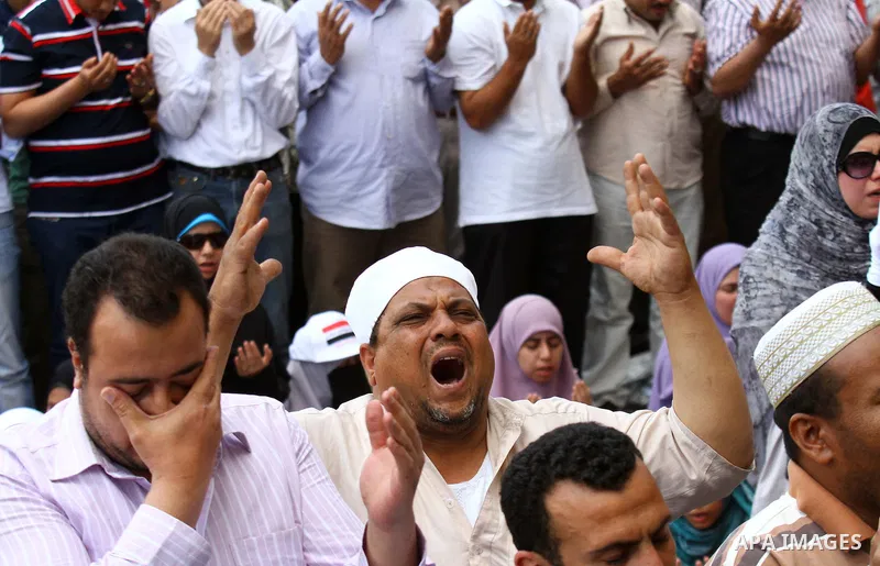 Egyptians attend Friday prayers at a rally at Cairo's Tahrir Square on May 13, 2011 during a protest calling for national unity after attacks on Egyptian churches, and solidarity with the Palestinians as they mark the "N...