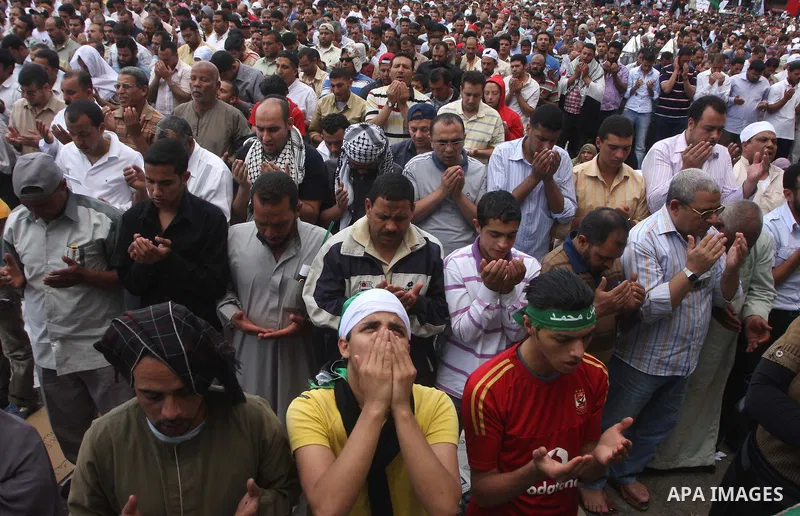 Egyptians attend Friday prayers at a rally at Cairo's Tahrir Square on May 13, 2011 during a protest calling for national unity after attacks on Egyptian churches, and solidarity with the Palestinians as they mark the "N...