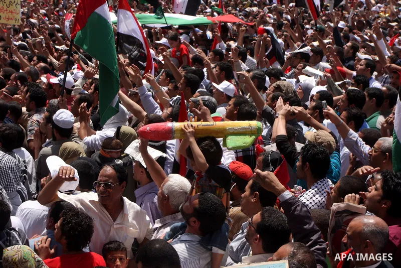 An Egyptian child holds a mock Qassam rocket during a rally at Cairo's Tahrir Square on May 13, 2011 during a protest calling for national unity after attacks on Egyptian churches, and solidarity with the Palestinians as...