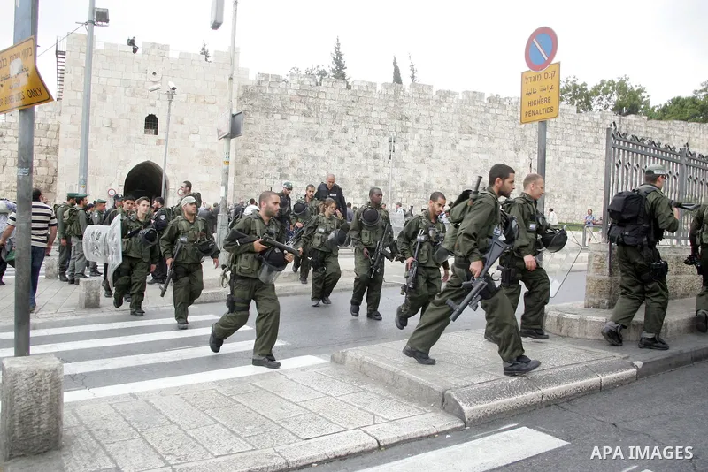 Israeli border policemen patrol the streets outside Jerusalem's Old City on May 13, 2011 amid tight security in the city, fearing violence as Palestinians began marking the "Nakba" or "catastrophe" which befell them foll...