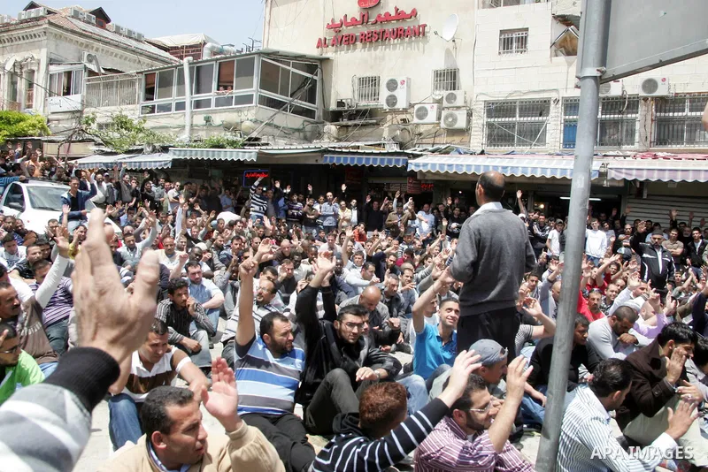 Palestinian Muslim worshipers perform Friday prayer outside Jerusalem's Old City on May 13, 2011 as Israeli police flooded the streets of Jerusalem, fearing violence as Palestinians began marking the "Nakba" or "catastro...