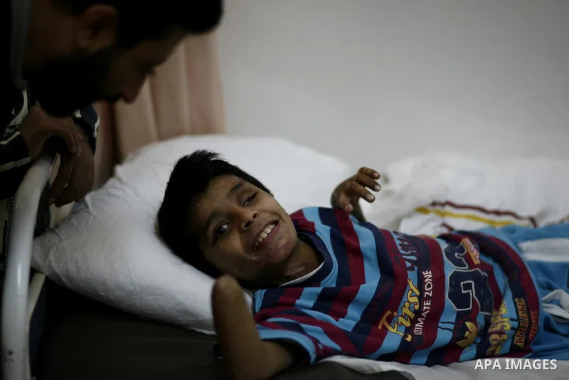 An injured Libyan boy, Mohammed al-Sheikh receives treatment at a hospital after being evacuated from the besieged Libyan city of Misrata at the port in the eastern rebel stronghold of Benghazi on May 13, 2011. A ship ca...