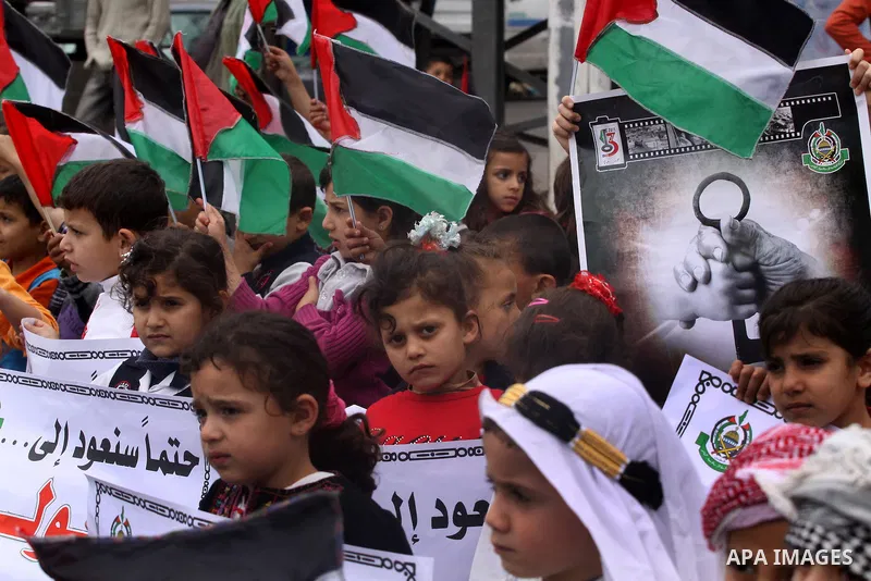 Palestinian children take part in a rally marking the 63rd anniversary of the 'Nakba', or 'Catastrophe', in Gaza City, Saturday, May 14, 2011. Hundreds of thousands of Palestinians were uprooted in the 1948 war that led...