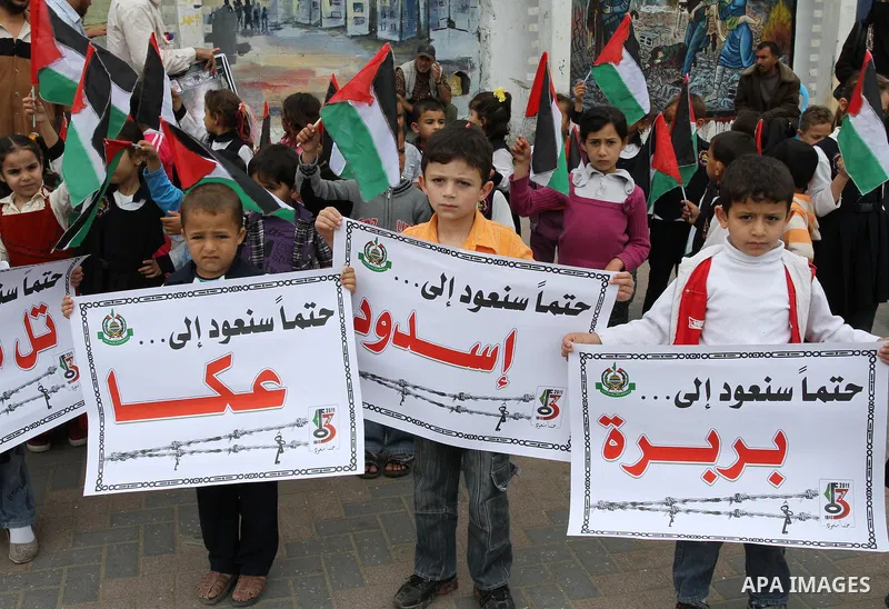 Palestinian children take part in a rally marking the 63rd anniversary of the 'Nakba', or 'Catastrophe', in Gaza City, Saturday, May 14, 2011. Hundreds of thousands of Palestinians were uprooted in the 1948 war that led...