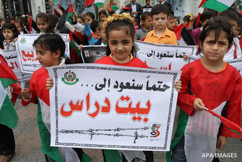 Palestinian children take part in a rally marking the 63rd anniversary of the 'Nakba', or 'Catastrophe', in Gaza City, Saturday, May 14, 2011. Hundreds of thousands of Palestinians were uprooted in the 1948 war that led...