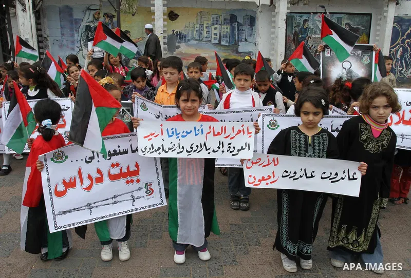 Palestinian children take part in a rally marking the 63rd anniversary of the 'Nakba', or 'Catastrophe', in Gaza City, Saturday, May 14, 2011. Hundreds of thousands of Palestinians were uprooted in the 1948 war that led...