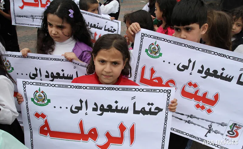 Palestinian children take part in a rally marking the 63rd anniversary of the 'Nakba', or 'Catastrophe', in Gaza City, Saturday, May 14, 2011. Hundreds of thousands of Palestinians were uprooted in the 1948 war that led...