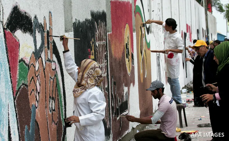Palestinian Artists take part in paint a murals to mark the 63th anniversary of "Nakba" (catastrophe), in Gaza City, on May 14, 2011. Hundreds of thousands of Palestinians were uprooted in the 1948 war that led to Israel...