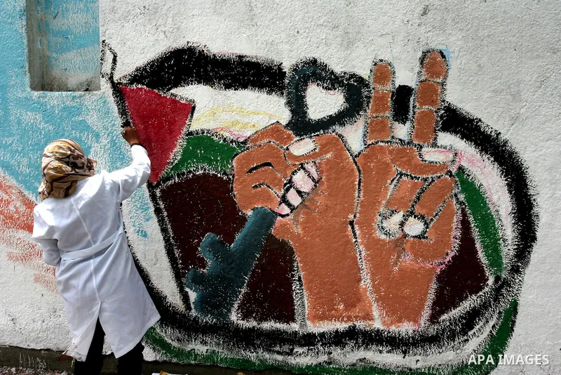 Palestinian Artists take part in paint a murals to mark the 63th anniversary of "Nakba" (catastrophe), in Gaza City, on May 14, 2011. Hundreds of thousands of Palestinians were uprooted in the 1948 war that led to Israel...