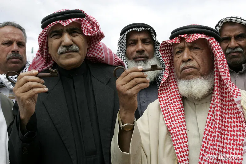 Palestinian men gather at the "Camp of Return" tent to stress the refugees' ties to their ancestral land on May 14, 2011 in the southern Gaza Strip refugee camp of Rafah, where Palestinians are marking the 63rd anniversa...