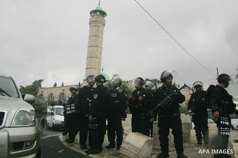 Israeli riot police stand guard during clashes with Palestinian youths following the funeral of a teenager who died after being shot as Palestinians launched events to mourn the 1948 creation of the Jewish state in Jerus...