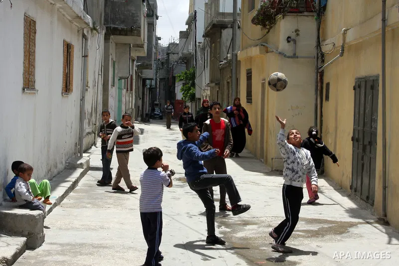 Palestinians boys play in alley of the Refugee camp of AL Aroub , near the West bank city of Hebron, on May 14, 2011. Palestinians commemorate the 63rd anniversary of Nakba, or catastrophe, the Arabic term used to descri...