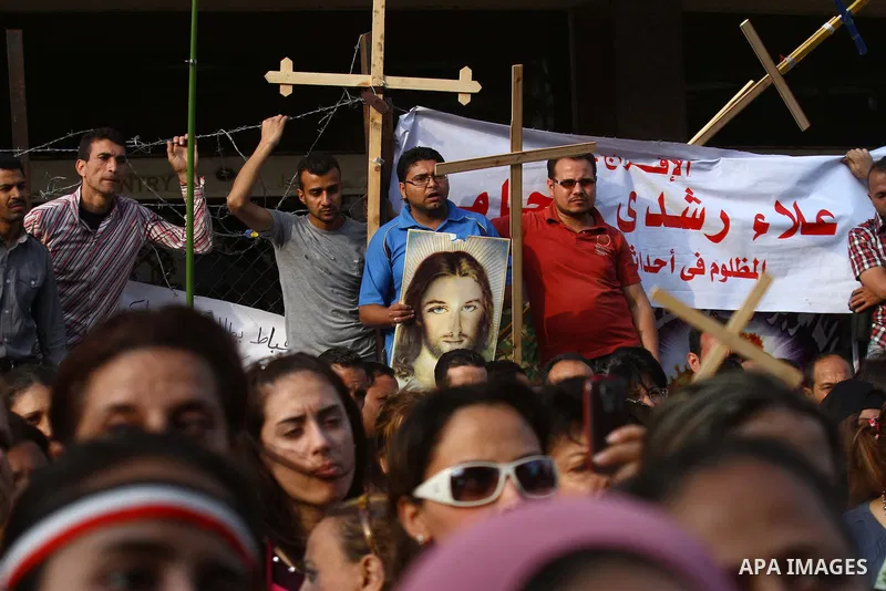 Egyptian Coptic Christians protest in front of the state television building in Cairo on May 14, 2011 against recent attempts to trigger sectarian conflict in the country. Photo by Ashraf Amra
