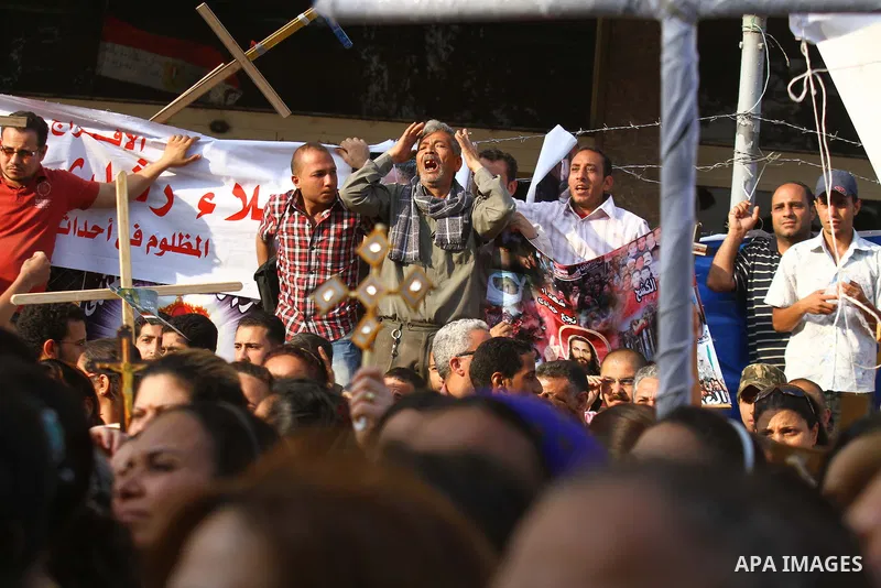 Egyptian Coptic Christians protest in front of the state television building in Cairo on May 14, 2011 against recent attempts to trigger sectarian conflict in the country. Photo by Ashraf Amra