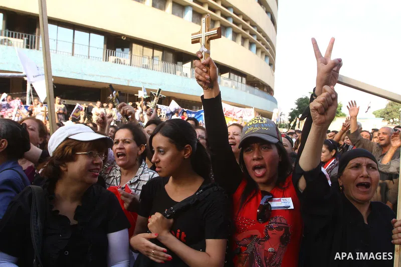 Egyptian Coptic Christians protest in front of the state television building in Cairo on May 14, 2011 against recent attempts to trigger sectarian conflict in the country. Photo by Ashraf Amra