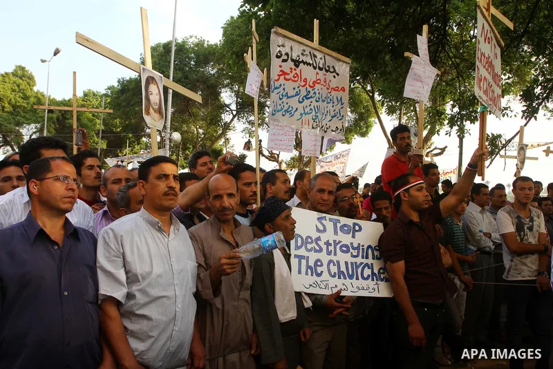 Egyptian Coptic Christians protest in front of the state television building in Cairo on May 14, 2011 against recent attempts to trigger sectarian conflict in the country. Photo by Ashraf Amra